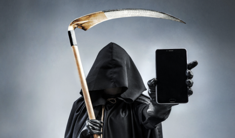 Grim reaper holding mobile phone